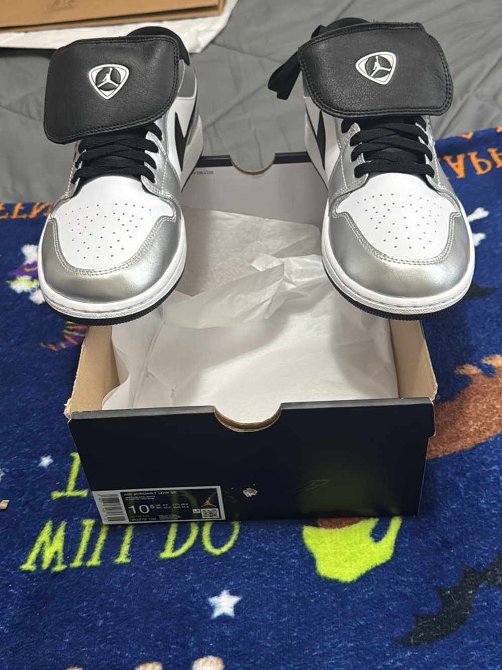 Air Jordan 1 Low Sneakers in Silver and Black